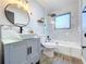 Updated bathroom featuring a modern vanity, new lighting, and a stylish tiled shower at 905 W 11Th Ave, Mount Dora, FL 32757