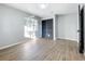 Bedroom features new flooring, a modern light fixture, a closet, and window views at 905 W 11Th Ave, Mount Dora, FL 32757