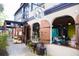 Charming building exterior with flower shop and restaurant, showcasing unique architectural details at 905 W 11Th Ave, Mount Dora, FL 32757