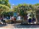 Charming community park area featuring beautiful landscaping, trellises, and a decorative water fountain at 905 W 11Th Ave, Mount Dora, FL 32757