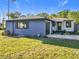 This home boasts a well-maintained lawn, garage, and updated exterior paint scheme at 905 W 11Th Ave, Mount Dora, FL 32757