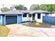 The exterior of this house offers a garage and modern touches at 905 W 11Th Ave, Mount Dora, FL 32757