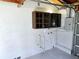 Well-lit garage area, complete with cabinet storage, perfect for organization and convenient access at 905 W 11Th Ave, Mount Dora, FL 32757