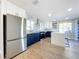Modern kitchen features stainless steel appliances, new cabinets, and quartz countertops at 905 W 11Th Ave, Mount Dora, FL 32757