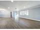 Spacious living room with lots of natural light and vinyl plank flooring at 905 W 11Th Ave, Mount Dora, FL 32757