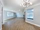 Bright living room with wood floors, fireplace, and lots of natural light with a view to the pool at 905 W 11Th Ave, Mount Dora, FL 32757