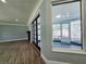 Spacious living room with wood floors, fireplace, and glass doors leading to the pool area at 905 W 11Th Ave, Mount Dora, FL 32757