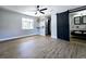 Modern main bedroom featuring a sliding barn door, light gray walls, and ample natural light at 905 W 11Th Ave, Mount Dora, FL 32757