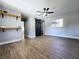 Spacious main bedroom features vinyl floors, a ceiling fan, and modern closet door at 905 W 11Th Ave, Mount Dora, FL 32757