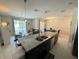 Stylish kitchen featuring granite counters, stainless steel appliances and open layout to living areas at 9055 Dogleg Dr, Davenport, FL 33896