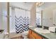 Cozy bathroom features a shower, toilet, and wood laminate flooring at 997 Lake Berkley Dr, Kissimmee, FL 34746