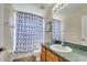 Well lit bathroom features a tub with shower, toilet, and tile floor at 997 Lake Berkley Dr, Kissimmee, FL 34746
