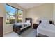 This bedroom has two twin beds, natural light from the large window, and tile flooring at 997 Lake Berkley Dr, Kissimmee, FL 34746