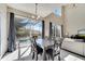 The dining area adjacent to the pool has sliding glass doors, tiled floors and modern lighting at 997 Lake Berkley Dr, Kissimmee, FL 34746