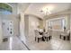 Bright dining room features tile floors, wainscoting and a picture window providing lots of natural light at 997 Lake Berkley Dr, Kissimmee, FL 34746