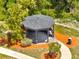 Secluded gazebo surrounded by lush landscaping, providing a tranquil spot for relaxation at 997 Lake Berkley Dr, Kissimmee, FL 34746