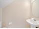 The half-bathroom has tile floors and a pedestal sink at 997 Lake Berkley Dr, Kissimmee, FL 34746