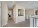 Hallway leading to multiple bedrooms, closets, and a staircase at 997 Lake Berkley Dr, Kissimmee, FL 34746