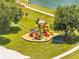 A vibrant playground with colorful slides and equipment sits on a grassy area surrounded by mature trees at 997 Lake Berkley Dr, Kissimmee, FL 34746
