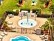 Gathering-friendly splash pad area with water features and lounge chairs, surrounded by greenery and picnic spots at 997 Lake Berkley Dr, Kissimmee, FL 34746