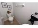 Cozy half bath with decorative wall art, providing a convenient and stylish powder room at 10116 Shadow Leaf Ct, Orlando, FL 32825