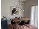 Elegant dining room with modern lighting, stylish decor, and a cozy atmosphere for gatherings at 10116 Shadow Leaf Ct, Orlando, FL 32825
