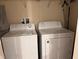 Laundry room features a white washer and dryer at 10116 Shadow Leaf Ct, Orlando, FL 32825