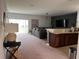 Bright and airy living room showcasing seamless flow to the dining area and contemporary design at 10116 Shadow Leaf Ct, Orlando, FL 32825