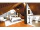 Bedroom with hardwood flooring, neutral walls, vaulted wood ceiling and ensuite bathroom at 1018 Jersey Ave, St Cloud, FL 34769