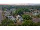 Aerial view of a residential neighborhood, showcasing well-maintained homes and tree-lined streets at 1018 Jersey Ave, St Cloud, FL 34769