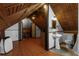 Attic bathroom featuring a unique wooden ceiling, pedestal sink, and vintage-style mirror at 1018 Jersey Ave, St Cloud, FL 34769