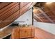 Attic kitchenette offering wood cabinets, sink, and counter space under a wood paneled ceiling at 1018 Jersey Ave, St Cloud, FL 34769