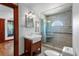 Stylish bathroom featuring tiled shower with window, vanity sink, and modern fixtures at 1018 Jersey Ave, St Cloud, FL 34769