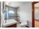 Well-lit bathroom featuring stylish tiled shower, vanity sink, and modern fixtures at 1018 Jersey Ave, St Cloud, FL 34769