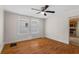 Bedroom with hardwood floors adjacent to kitchen at 1018 Jersey Ave, St Cloud, FL 34769