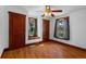 Cozy bedroom with hardwood floors, natural light, and classic wood trim throughout at 1018 Jersey Ave, St Cloud, FL 34769