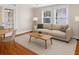 Living room with neutral colors, hardwood floors, and natural light from windows at 1018 Jersey Ave, St Cloud, FL 34769