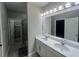 Elegant bathroom with double vanity sinks and modern lighting, providing a luxurious feel at 12253 S Bracco St, Winter Garden, FL 34787