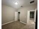 Cozy bedroom with neutral tones, carpet flooring, and access to closet and other rooms at 12253 S Bracco St, Winter Garden, FL 34787
