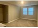 Inviting living room area with bright windows, neutral paint and plush carpet flooring at 12253 S Bracco St, Winter Garden, FL 34787