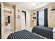 Bedroom featuring two twin beds, coastal decor, and a closet with sliding doors at 130 Los Gatos Pl, Kissimmee, FL 34759
