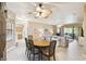 Open-concept dining and living area with lots of natural light and neutral decor at 130 Los Gatos Pl, Kissimmee, FL 34759