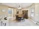 Bright dining room features tile floors, built-in hutch, and an elegant dining set at 130 Los Gatos Pl, Kissimmee, FL 34759