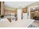 Spacious kitchen with breakfast bar and modern white appliances at 130 Los Gatos Pl, Kissimmee, FL 34759