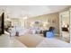 A spacious living room featuring comfortable seating, a ceiling fan, and views into dining room at 130 Los Gatos Pl, Kissimmee, FL 34759