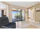 A bright living room with sliding glass doors that open to the outside patio area at 130 Los Gatos Pl, Kissimmee, FL 34759