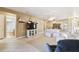 A spacious living room featuring comfortable seating and views into dining and bathrooms at 130 Los Gatos Pl, Kissimmee, FL 34759