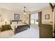 Comfortable bedroom with carpet, a ceiling fan, a window, and matching furniture at 130 Los Gatos Pl, Kissimmee, FL 34759