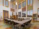 Bright meeting room featuring large windows, ample seating, and a colorful floor at 130 Los Gatos Pl, Kissimmee, FL 34759