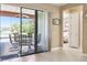 Covered outdoor patio includes comfortable seating and access to the Primary bedroom at 130 Los Gatos Pl, Kissimmee, FL 34759